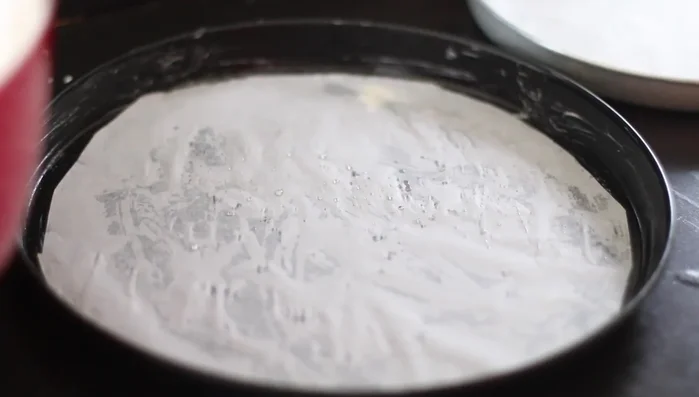 Grease and line an 11-inch pizza pan (or similar). Pour in the batter and spread evenly.