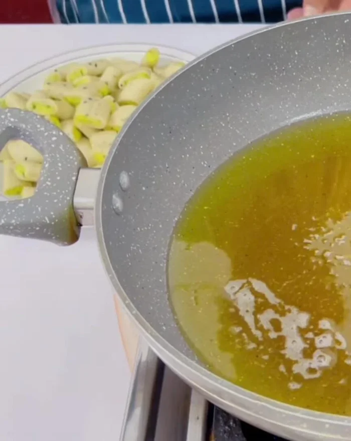 Fry the snacks: Heat cooking oil in a pan on low heat. Fry the snacks for 1-2 minutes on each side, stirring occasionally, until golden brown and crispy.
