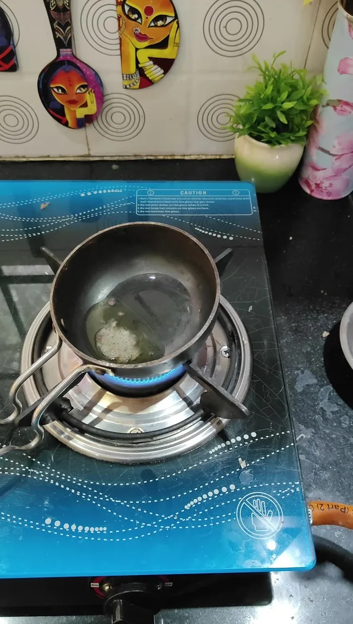 Temper the chutney by heating oil and adding mustard seeds, cumin seeds, asafoetida, and sweet neem leaves. Pour over the chutney. (318)