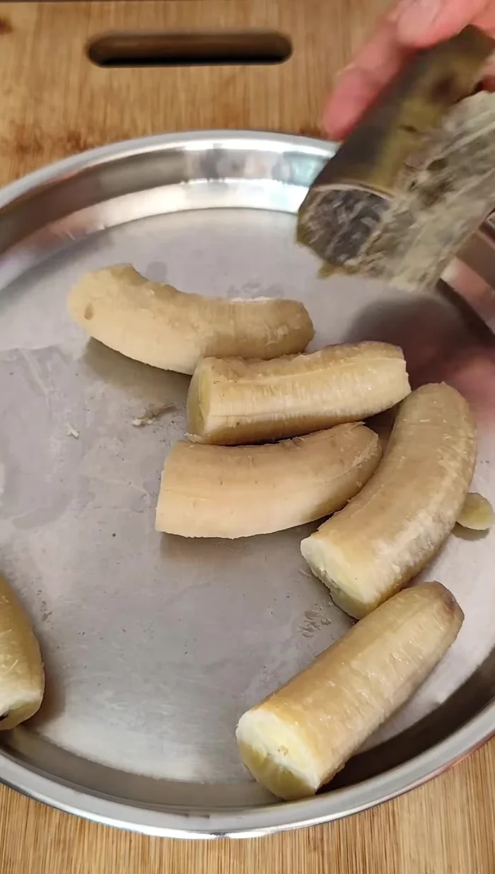 Prepare the banana: Boil, peel, and grate 3 raw bananas.