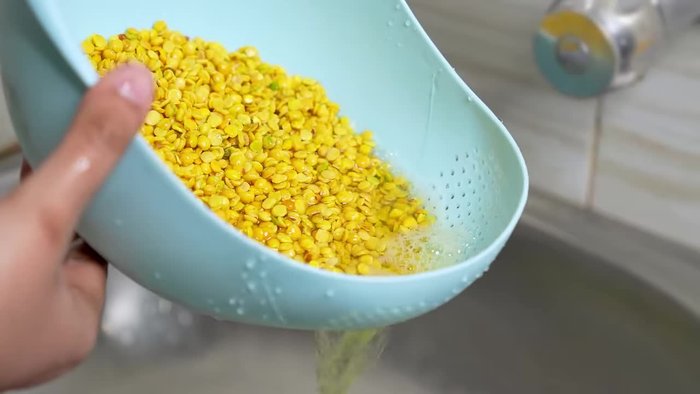 Pressure cook the rinsed dal with turmeric, salt, and water for 2-3 whistles. Release the pressure naturally.