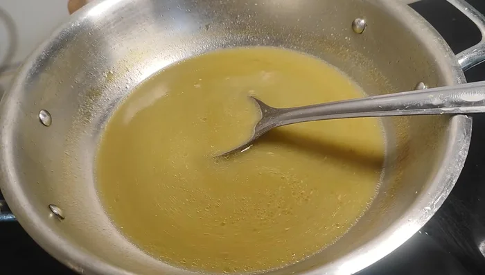 Add the strained soup to the pan. Simmer for a few minutes.