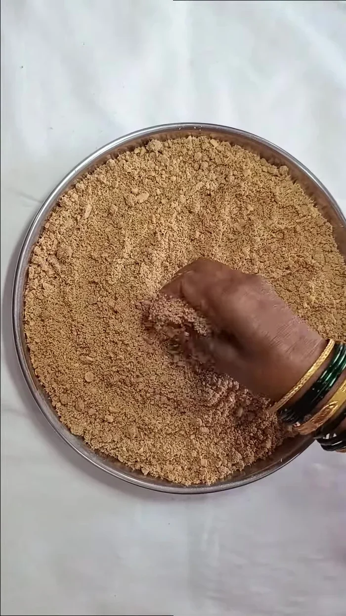 Lightly grease your hands with ghee. Press the mixture into small balls to form laddus.