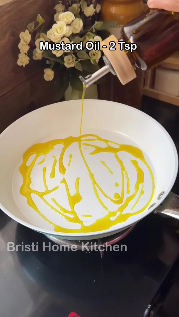 Heat mustard oil in a pan and sauté the stuffed ladyfingers until cooked (284.4).