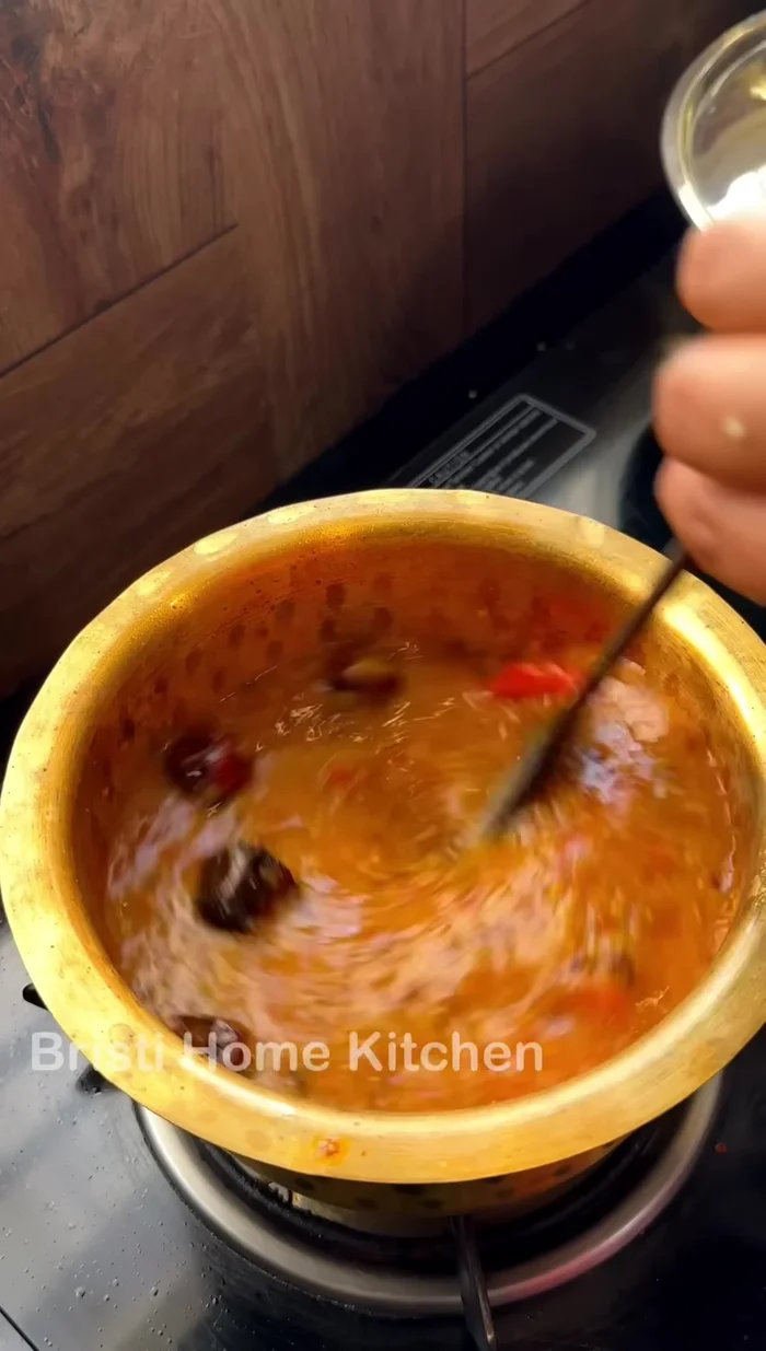 Add the cooked dal and simmer for 4-5 minutes (350.56).