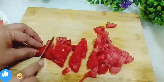 Cut the watermelon into small pieces.