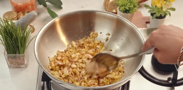 Add ginger-garlic paste and fry for 10-15 seconds. Add turmeric powder, red chili powder, coriander powder, cumin powder, and garam masala. Fry well.