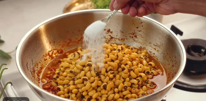 Add the boiled white kidney beans with a little water, along with salt (remember some salt was already used).