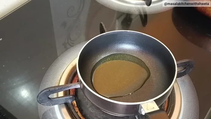 Prepare the tempering: Heat oil in a pan. Add asafoetida, mustard seeds, and turmeric powder. Mix well and turn off the heat.
