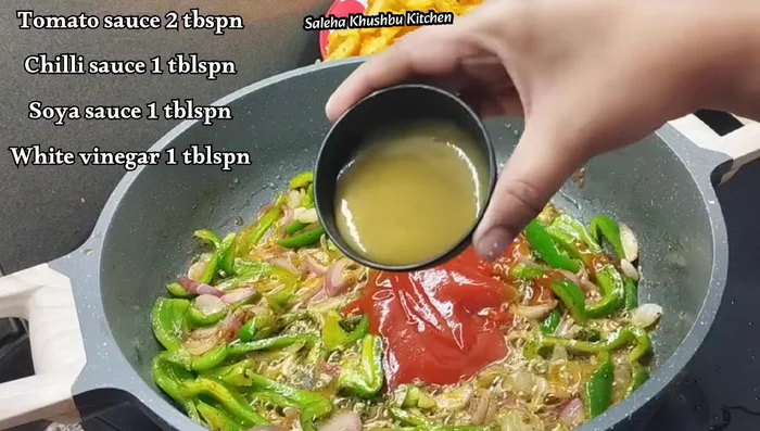 Add tomato ketchup, green chilli sauce, dark soy sauce, and white vinegar. Mix well.