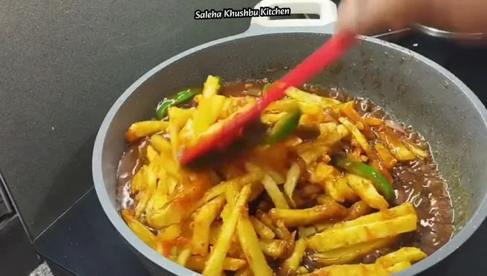 Add the fried potatoes to the sauce and mix well.