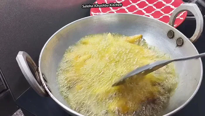 Deep fry the potatoes in hot oil until golden brown and crispy.