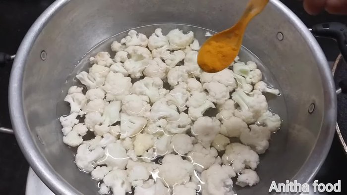 Boil cauliflower with turmeric powder and salt. Don't overboil.
