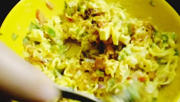 Add the Maggi masala packet. Mix well. Do not add any other spices unless desired.