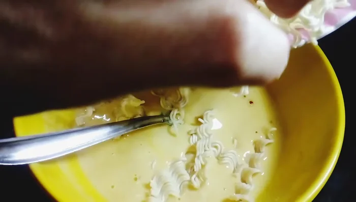 Break the Maggi noodles into small pieces and add them to the batter. Mix well and let it rest for 5 minutes.