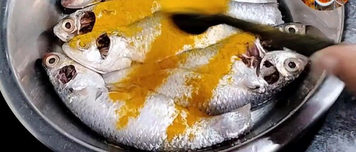 Marinate the fish with 1 teaspoon each of turmeric powder, red chili powder, and salt. Let it sit for 15-20 minutes.