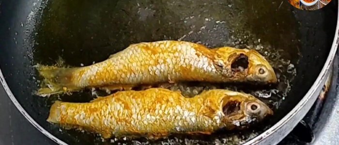 Heat mustard oil in a frying pan and fry the fish until crispy on both sides.