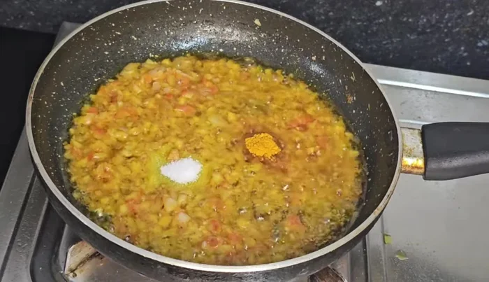 Add turmeric powder, salt, and Kashmiri chili powder (optional).