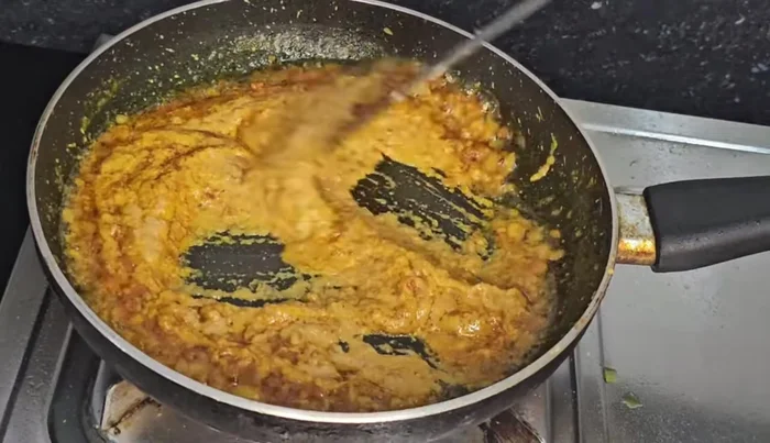 Fry the spices until oil separates from the masala.