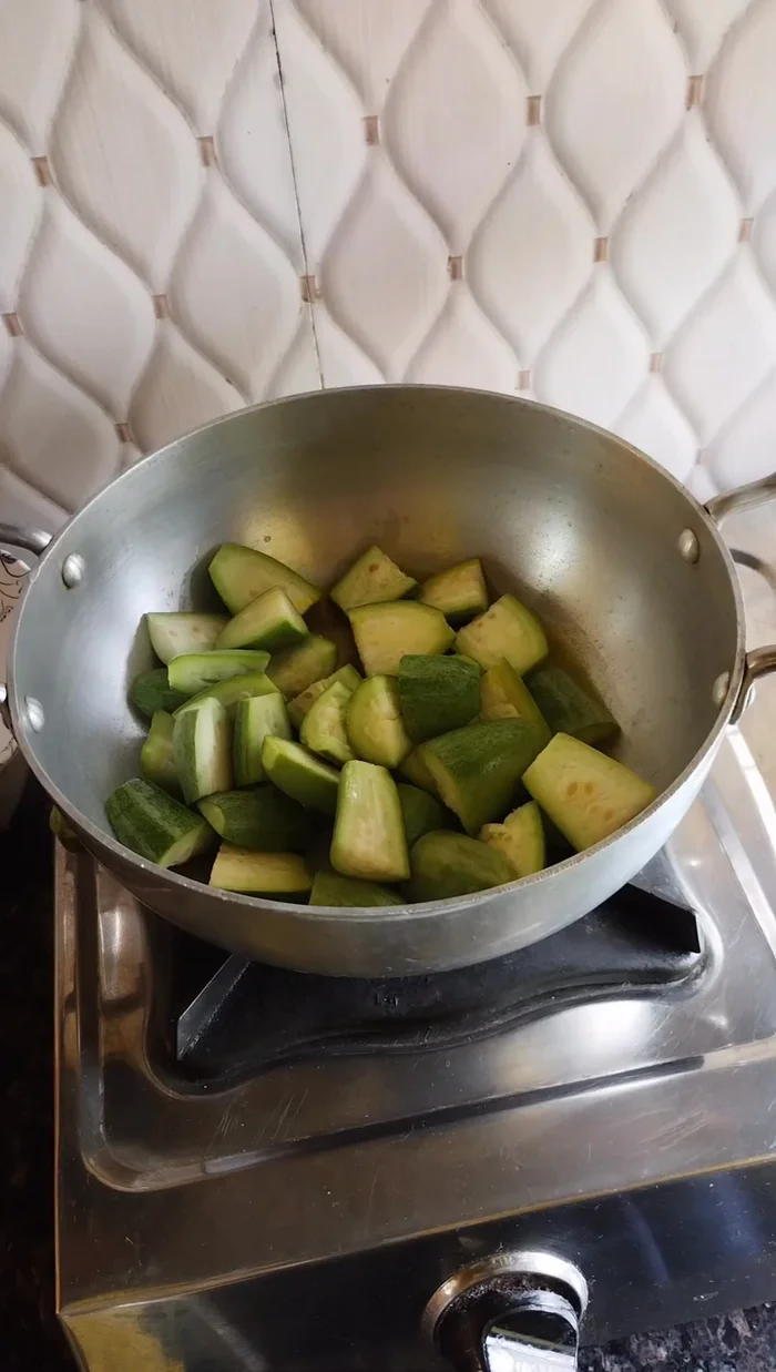 Fry the parwal: Heat oil in a pan. Add the chopped parwal and fry until it turns completely red.