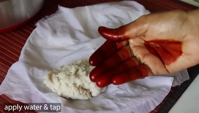 Line an idli steamer or plate with an idli cloth. Spoon the batter into the idli molds, applying a little water to your hands to prevent sticking.