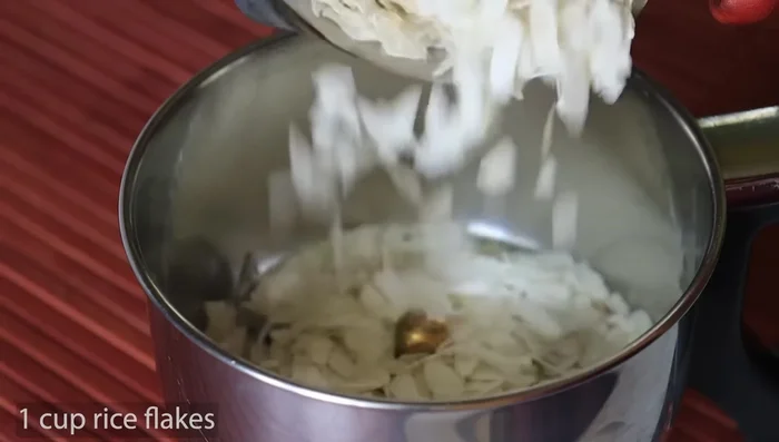 Grind 1 cup of aval into a fine powder using a mixie.