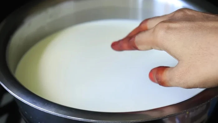 Continue to cook the milk mixture until it thickens.