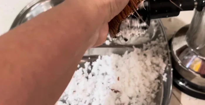 Grate one medium coconut. This makes grinding easier.