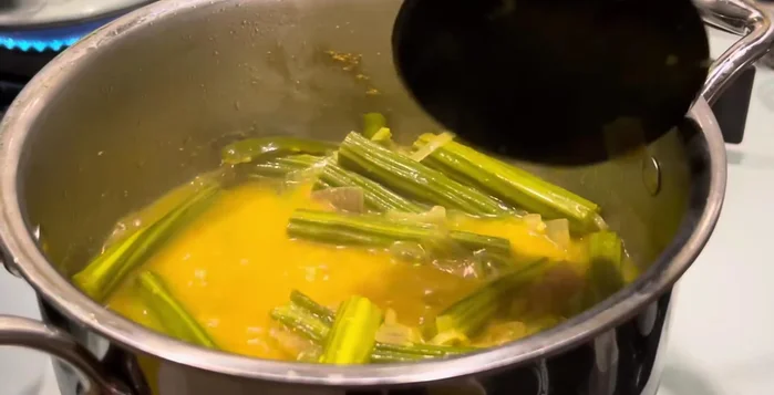 Add the remaining coconut masala paste and stir well.
