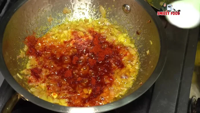 Add normal chili powder, salt, and finely chopped curry leaves to taste. Fry for a minute or two.