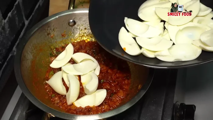 Add the chopped egg whites and mix gently, ensuring they don't break.
