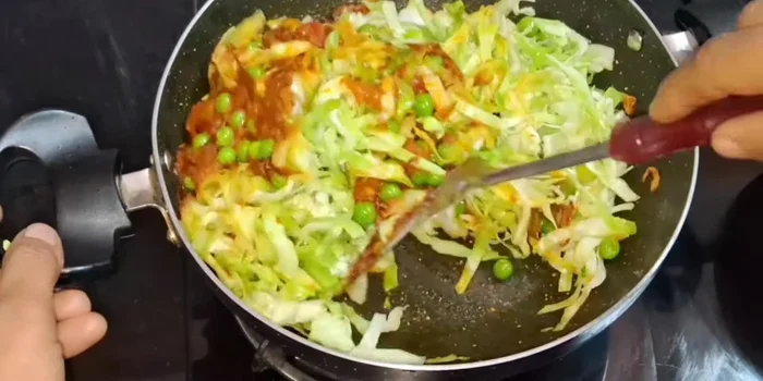 Add the cabbage and mix well. Cover and cook, stirring every two minutes to prevent burning.
