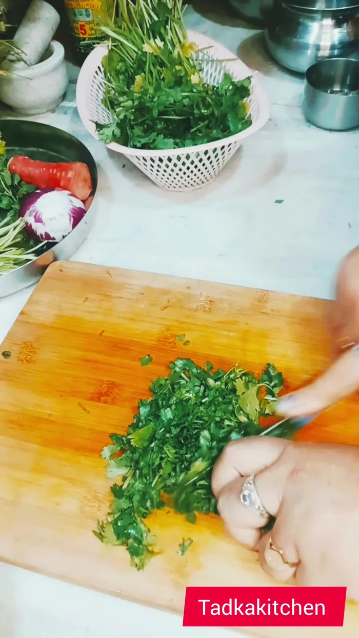 Combine the grated beetroot, potatoes, carrot, onions, mint, and coriander in a bowl.