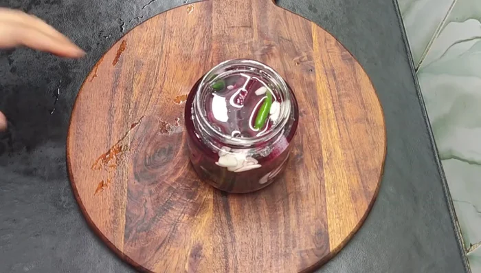 Ensure the jar is completely filled with beetroot, leaving minimal space at the top.