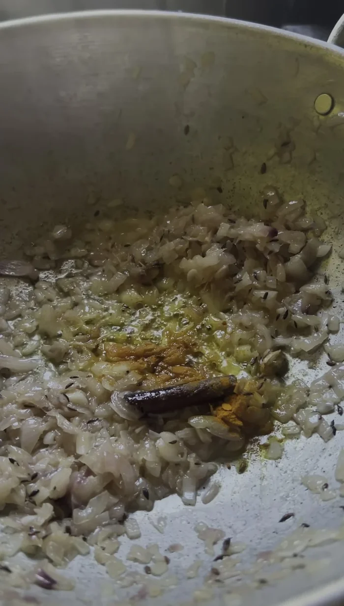 Add the prepared spices (turmeric, chili, coriander, cumin, garam masala). Saute until fragrant, ensuring it doesn't burn.