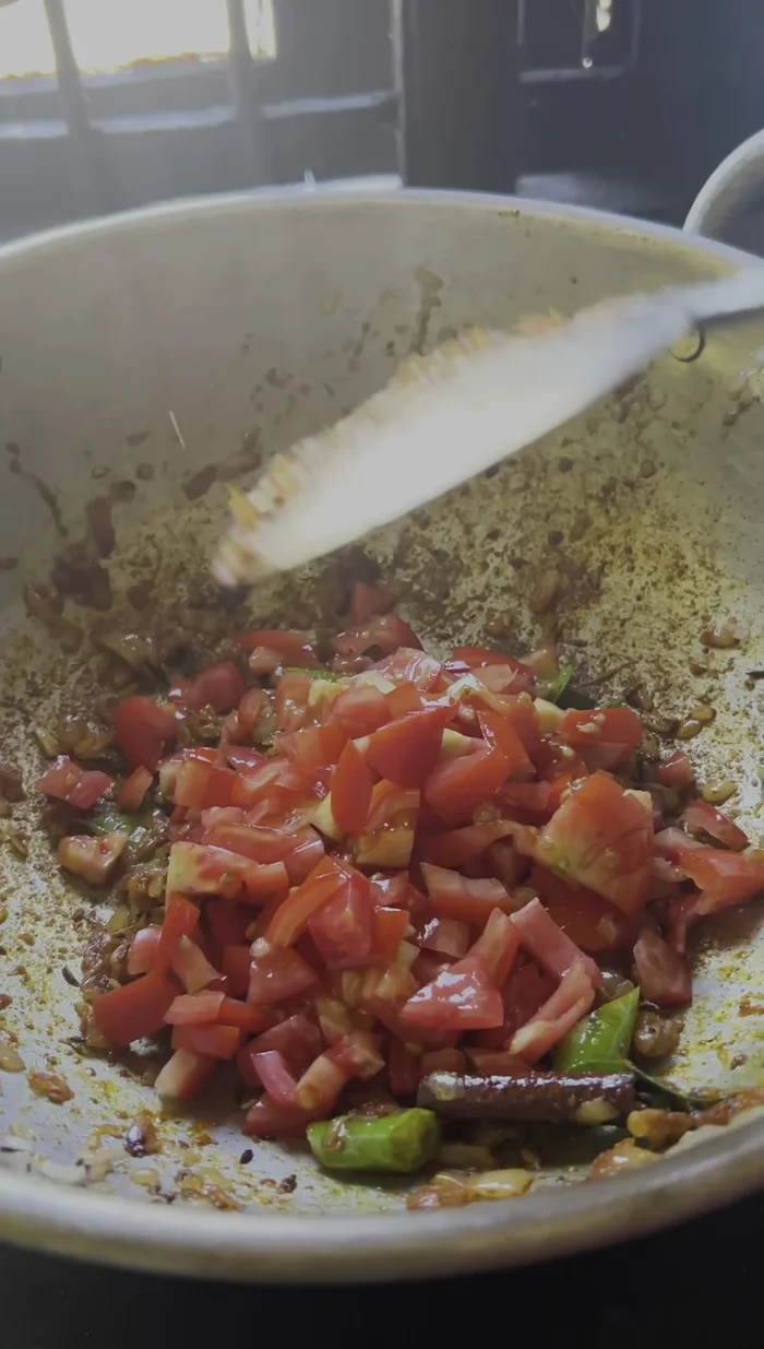 Add tomatoes and saute until softened slightly.