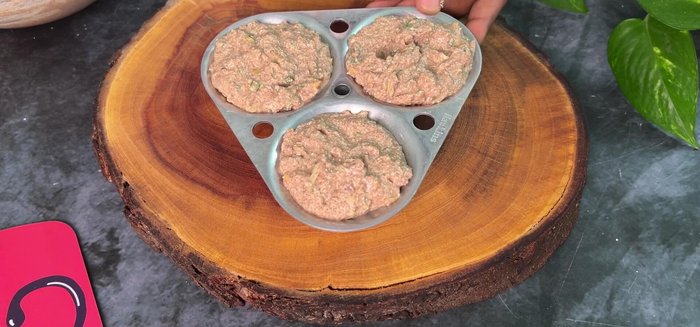 Grease an idli mould and fill it with batter (don’t overfill). Steam for 12-15 minutes in a cooker.