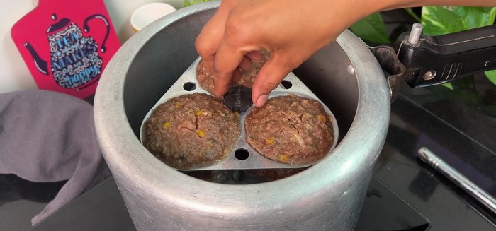 Once cooked, let the idlis cool slightly before removing from the mould.