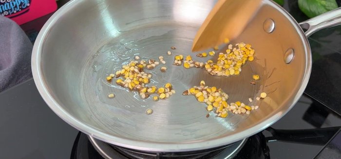 Add salt, ginger powder (or fresh ginger), turmeric, and asafoetida. Fry on low flame.