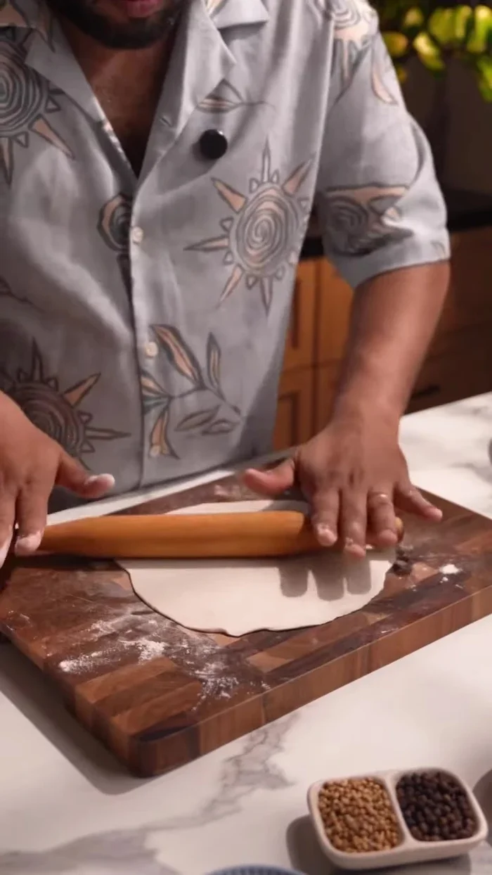 Gently stretch the paratha to about 10 inches.