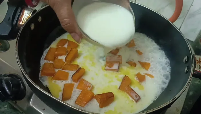 Add 3 cups of full cream milk and bring to a boil.