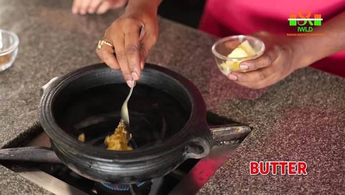 Heat butter in a sweet pot. Add cumin seeds and finely chopped garlic. Saute until fragrant.