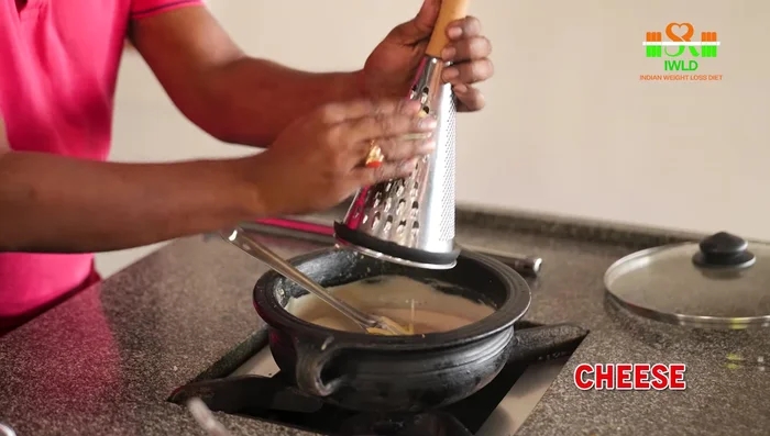 Remove from heat and top with grated cheese.