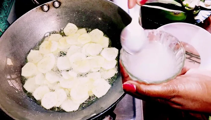 Stir the chips gently and fry them on medium heat until their color changes slightly.