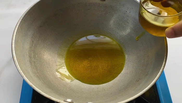 Heat mustard oil in a pan on medium flame.
