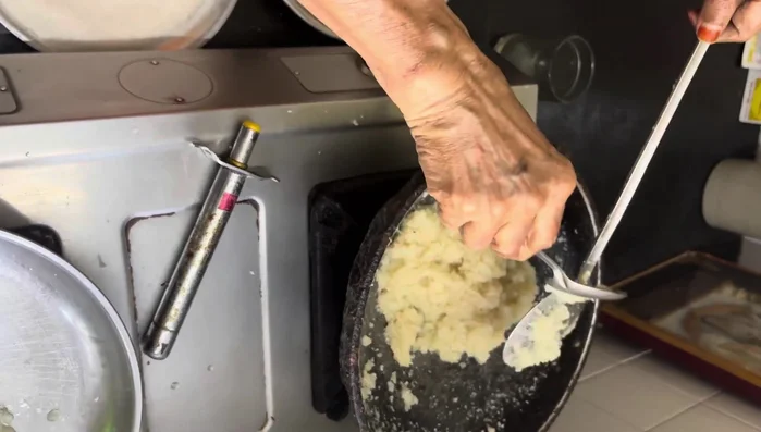 Continue stirring until the mixture is nearly dry (a few more minutes).