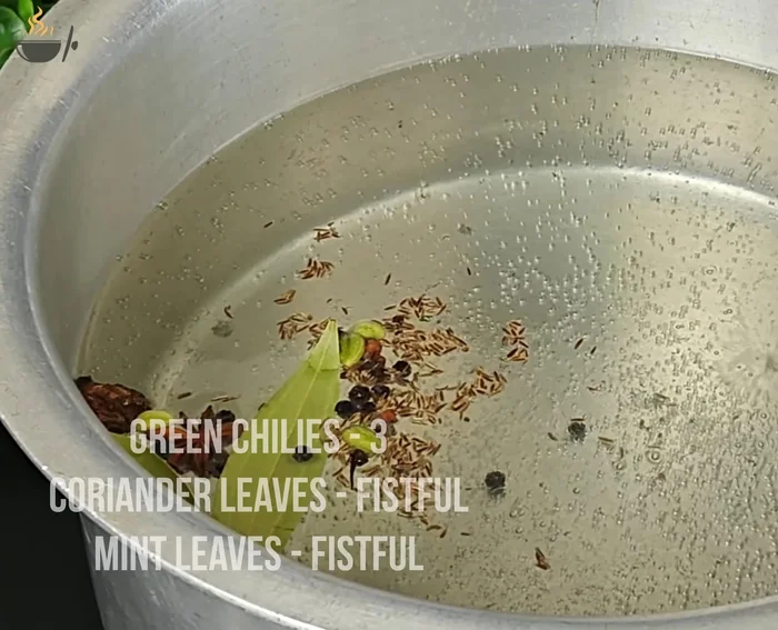 Boil 4 liters of water. Add whole spices, green chilies, coriander leaves, mint leaves, lemon juice, lemon peel, and salt. Bring to a boil.