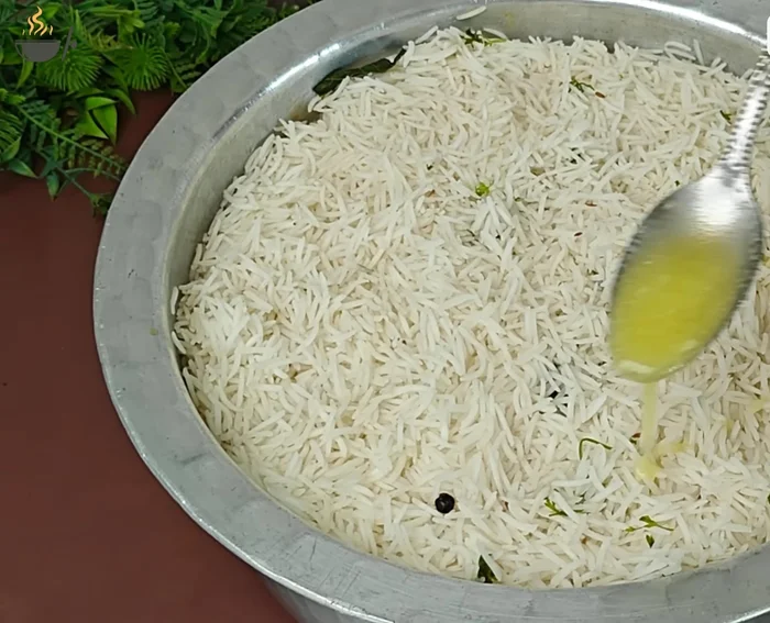 Pour 2-3 tablespoons of desi ghee over the rice.