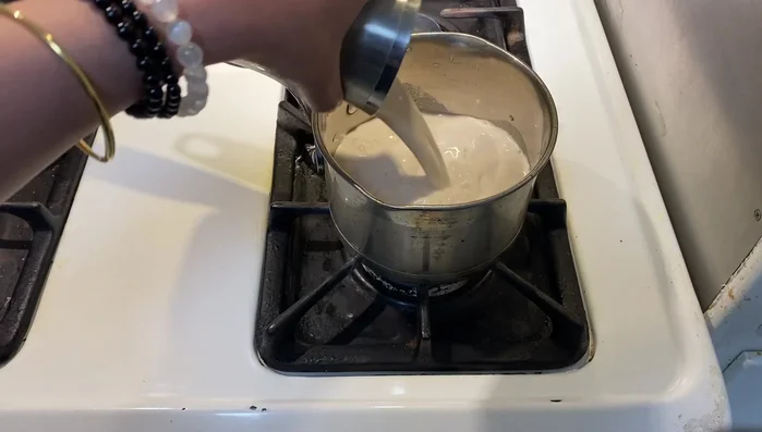 Heat 1 cup of almond milk in a pot over low heat. (133.68)