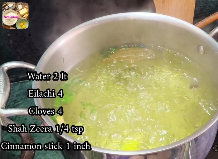 In a separate pot, heat water with 4 cardamoms, 4 cloves, 1/4 tsp shahjeera, 1-inch cinnamon stick, a little lemon peel, 2 bay leaves, and a little salt. Add 1 kg of washed basmati rice and cook until the first boil.